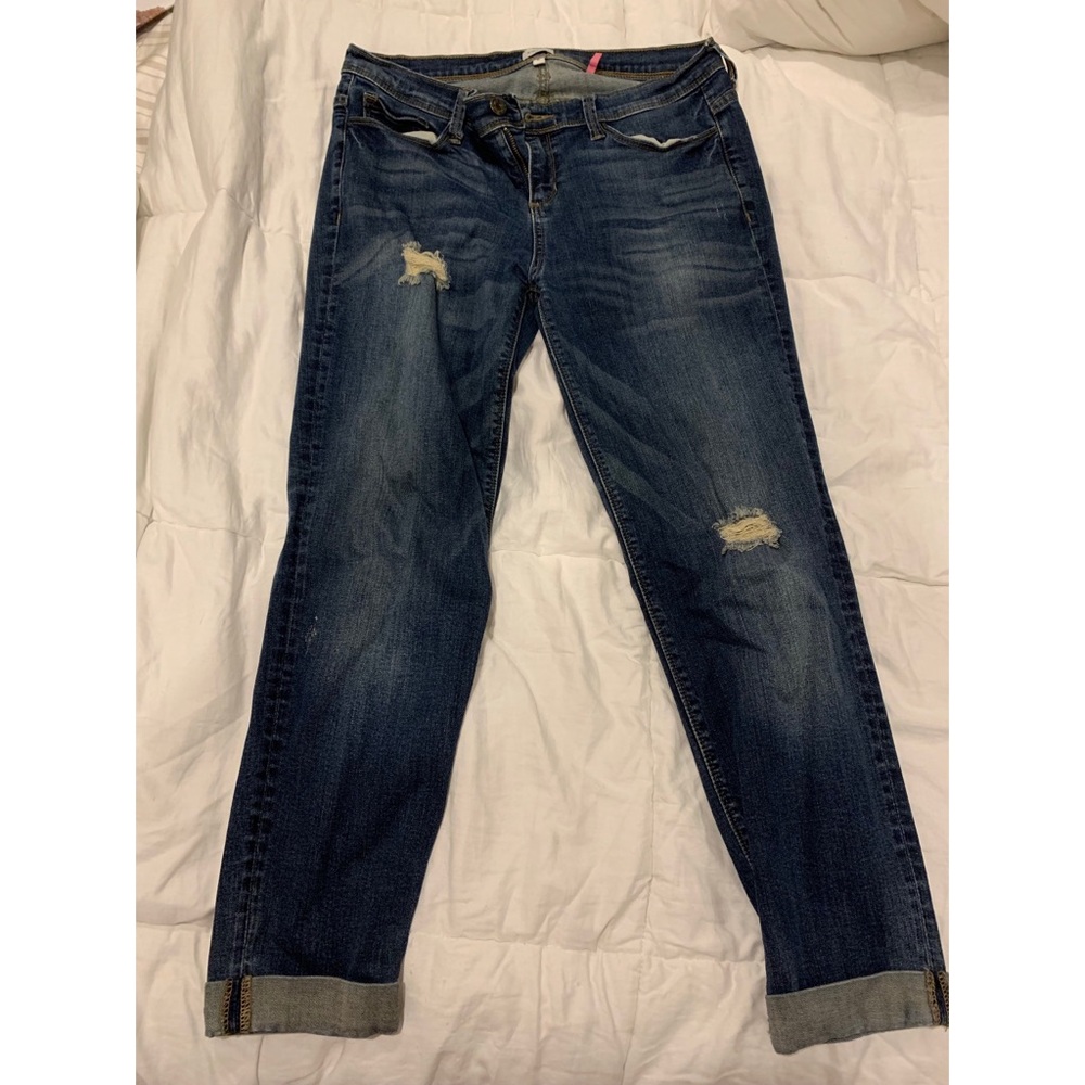 Women’s dark blue jeans with rips